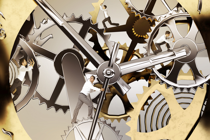 Decorative people walking around the inside of a clock