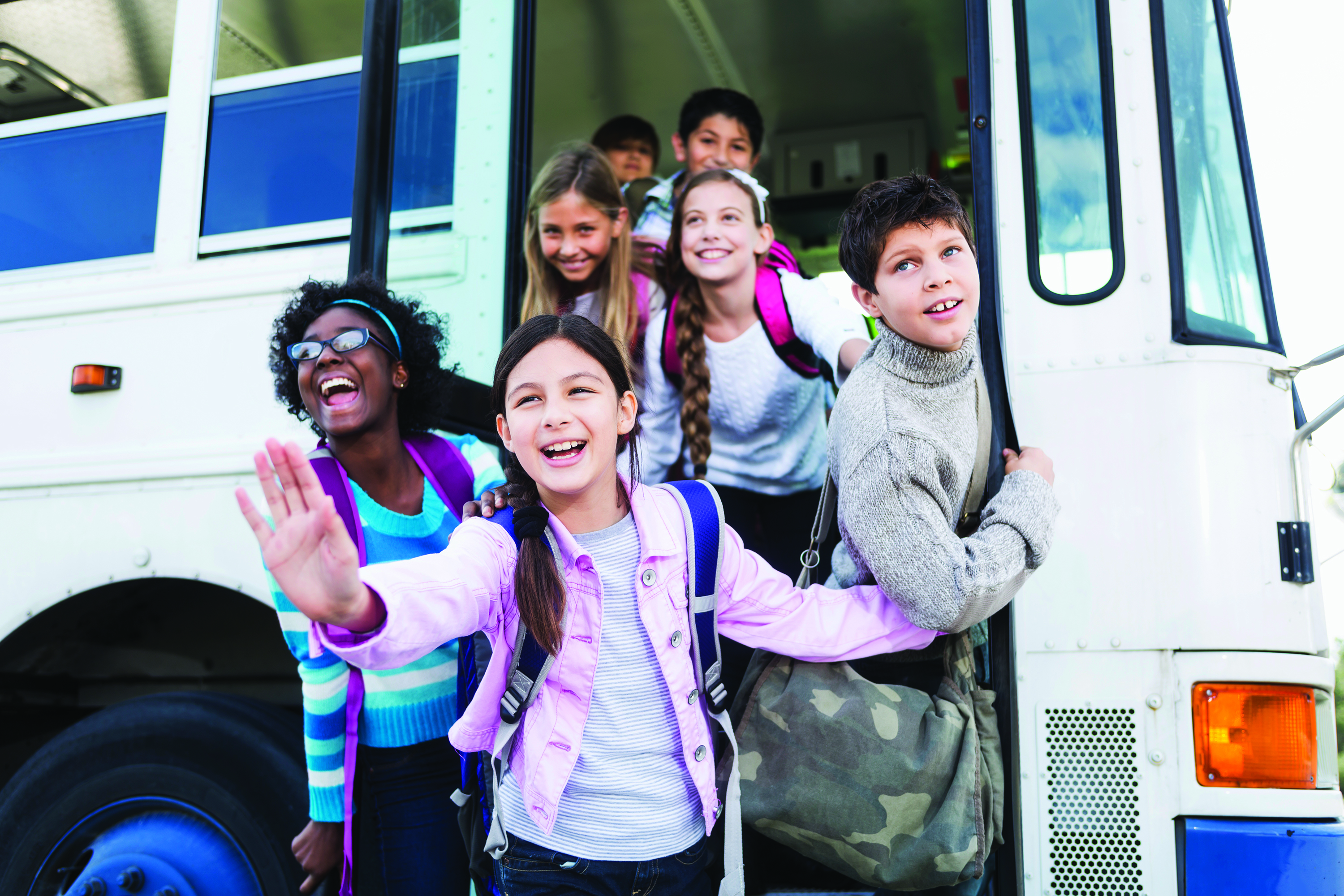 Students getting off a transit bus