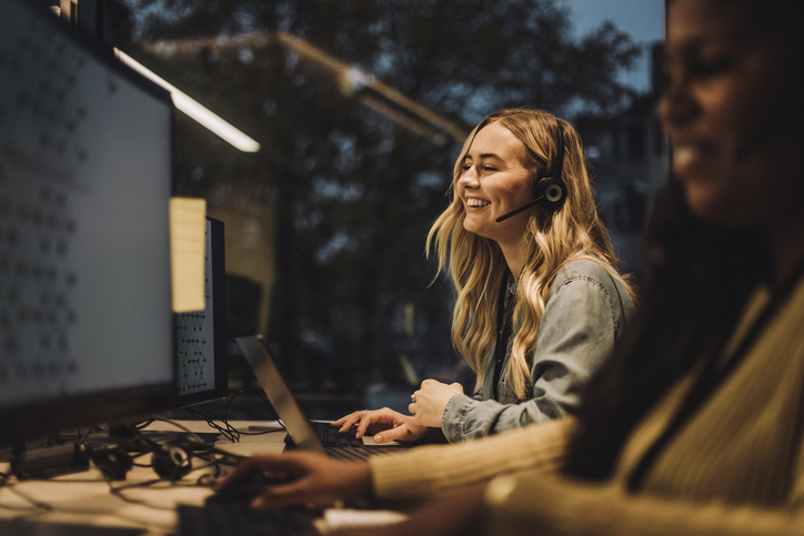 decorative professional assistants answering a call via headset on computer