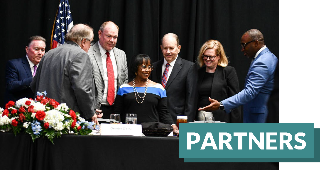 Government representatives from around the region at a luncheon.