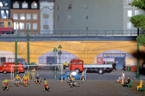 Diorama of city cars, trucks, trains, city park