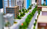 Toy car travelling through miniature city