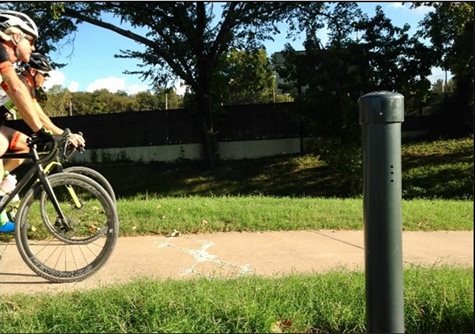 Bicyclist passing a traffic count post