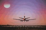 Airplane approaching runway with moon in view